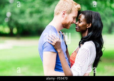 Couple in love hugging peacfully outdoors and being truly happy. Feeling of security and serenity Stock Photo