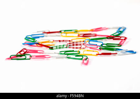 Coloured paper clips on white background Stock Photo