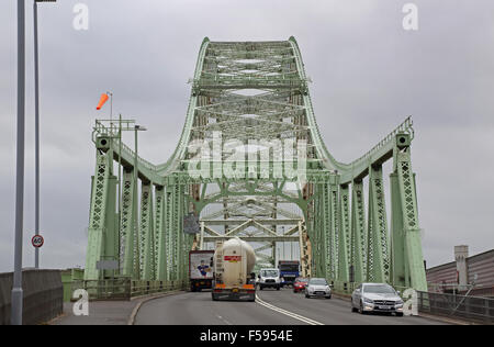 Traffic crossing the Silver Jubilee bridge over the River Mersey in Runcorn, UK. Bridge viewed from the north.