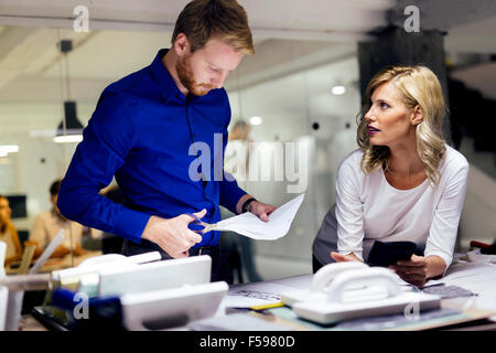 People working in fashion industry and designing clothes Stock Photo