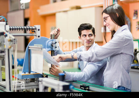 Two young students working on a science project together in lab Stock Photo