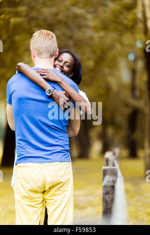 Couple in love hugging peacfully outdoors and being truly happy. Feeling of security and serenity Stock Photo