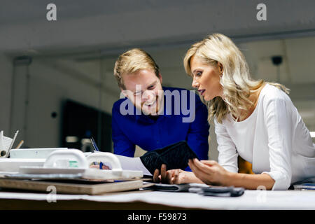 People working in fashion industry and designing clothes Stock Photo