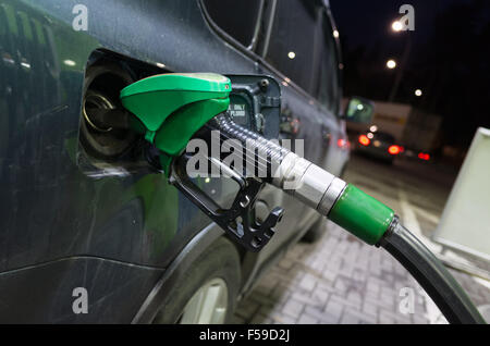 Filling modern car with petrol at an automatic gas station Stock Photo