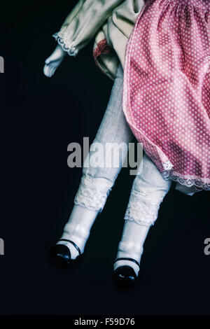 legs of a vintage doll Stock Photo