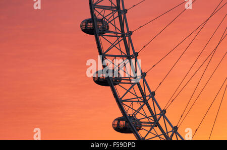 The London Eye ferris wheel is seen at sunrise near the River Thames, in London, England, on May 25, 2015. (Adrien Veczan) Stock Photo