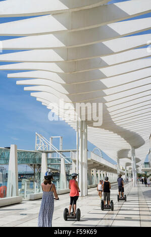 Sightseeing on segways through El Palmeral de las Sorpresas promenade at the port. Málaga, Andalusia, Spain Stock Photo