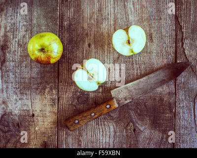 Oct. 30, 2015 - Apples and old knife on wooden weathering background © Igor Goiovniov/ZUMA Wire/Alamy Live News Stock Photo