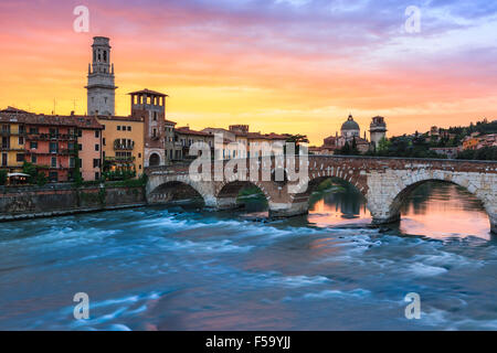 Ponte Pietra bridge at dusk over the Adige river in Verona, Italy Stock Photo