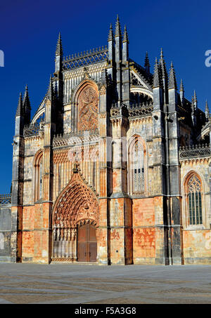Portugal: Main facade of the gothic monastery and church Santa Maria da Vitoria in Batalha Stock Photo