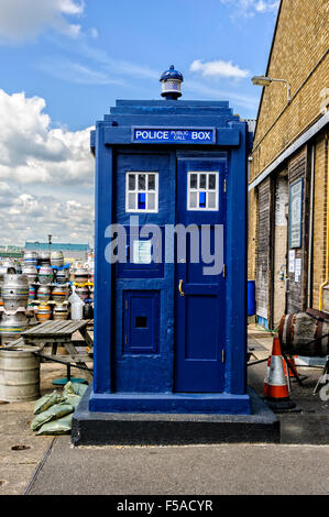 An old fashioned rectangular blue police box standing in front of the Kent police museum at Chatham Historic Dockyard Stock Photo