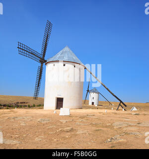 Two windmills, Campo de Criptana near Alcazar de San Juan, Castile  La Mancha. Castile La Mancha region, Spain, is famous due to Stock Photo