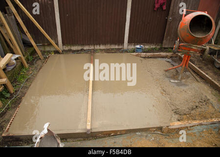 Smoothing of cement of a shed base Stock Photo