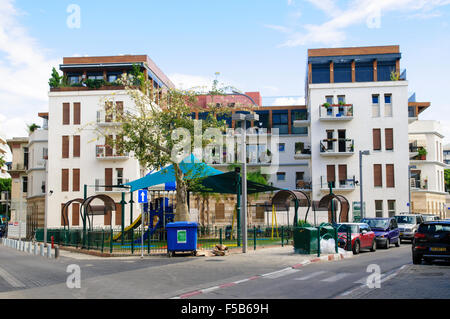 A new Apartment building in Jaffa Israel with a public playground in the foreground Stock Photo