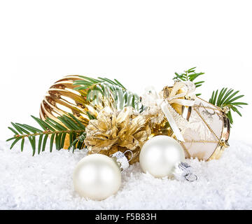Golden Christmas decoration on snow background, top isolated Stock Photo