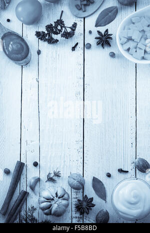 herbs and spices on wooden background Stock Photo