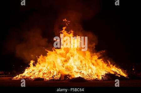 Bonfire burning in celebration of Guy Fawkes night in the UK. Stock Photo