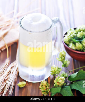 beer in glass and on the wooden table Stock Photo