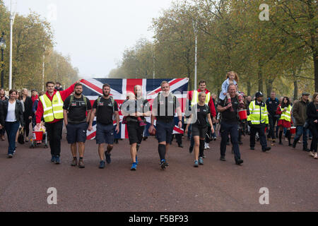 London, UK. 01st Nov, 2015. The Walk of Britain team, a team of wounded veterans walk down the Mall in London to Buckingham Palace followed by a large crowd of supporters and well wishers  on the Final day of their 1000 mile walk around Britain Credit:  Alan West/Alamy Live News Stock Photo