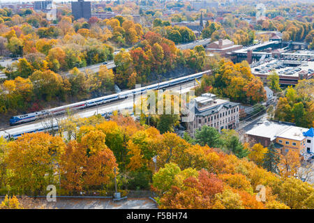 Aerial view from the Walkway over the Hudson of Metro-North Hudson Line and fall foliage in Poughkeepsie, New York Stock Photo