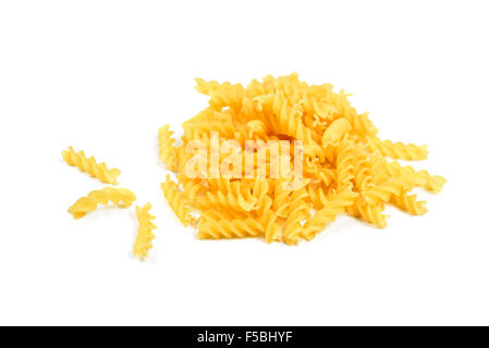 Rotini pasta heap and alone on white background Stock Photo