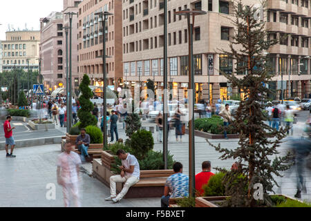 Pedestrians walking along Northern Avenue, a pedestrian street in Yerevan, the capital of Armenia. Stock Photo