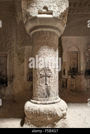 Stone column with carvings in the gavit of the Geghard monastery in Armenia. Stock Photo