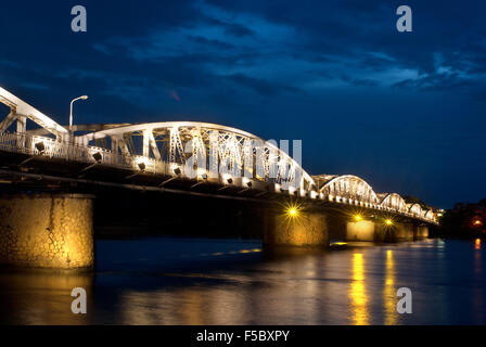 Illuminated Trang Tien Bridge over Perfume River, Hue, Vietnam. Bridge lit up at dusk, Trang Tien Bridge, Perfume River, Hue, Vi Stock Photo