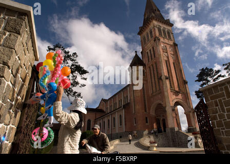 Notre Dame Cathedral, Ho Chi Minh City (Saigon), Vietnam, Indochina, Southeast Asia. People sell balloons outside of the Notre D Stock Photo