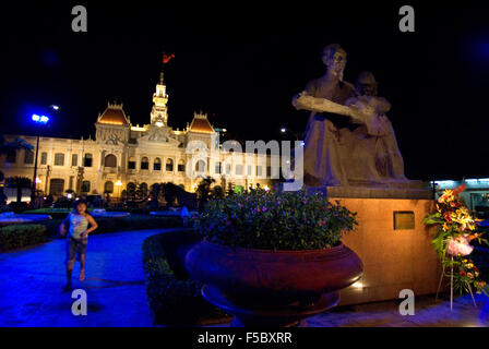 Statue of Ho Chi Minh, in Front of Hotel de Ville , Ho Chi Minh City , Vietnam. HSBC bank. Ho Chi Minh Statue, People's Committe Stock Photo