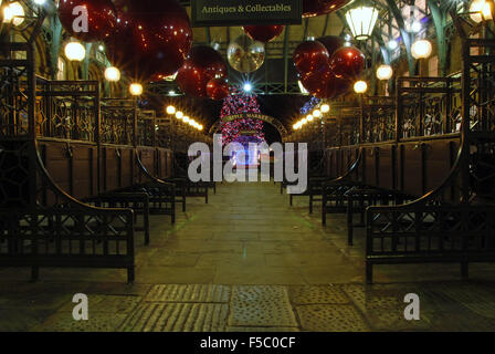 Apple Market antique wooden with lights and Christmas xmas decorations in Covent Garden, London England Stock Photo