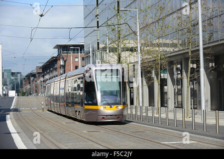 Luas red line tram heading for The Point terminal in Dublin, Ireland. Stock Photo