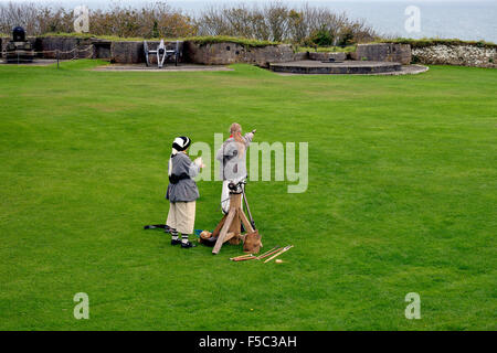 A demonstration of old weaponry at Pendennis Castle, Falmouth, Cornwall, England Stock Photo