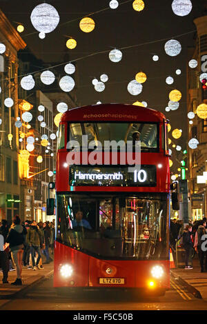 London, UK. 1st November 2015. Red London double decker bus at the switching on of Oxford Street Christmas lights and Xmas decorations in London but some failed to switch on immediately and only came on later Credit:  Paul Brown/Alamy Live News Stock Photo