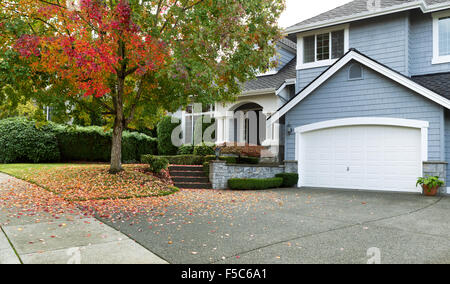 Detached house USA - large single family modern USA house with trees and lawn in Autumn season Stock Photo