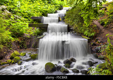 Cascade waterfall in Planten un Blomen park in Hamburg, Germany Stock Photo