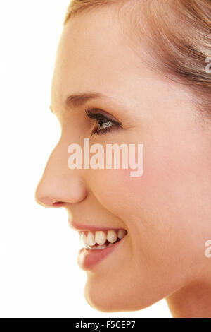 Young happy blonde woman in profile view Stock Photo