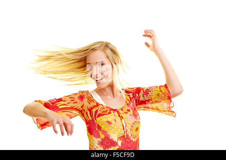 Young woman with long blonde hair dancing Stock Photo
