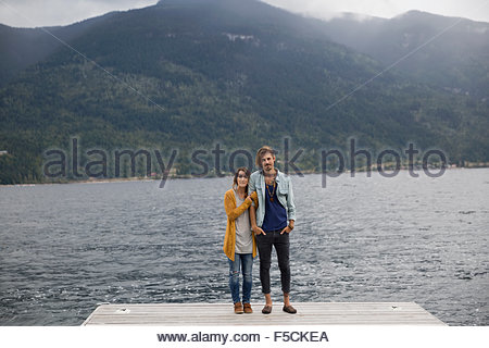 Portrait couple on lake dock