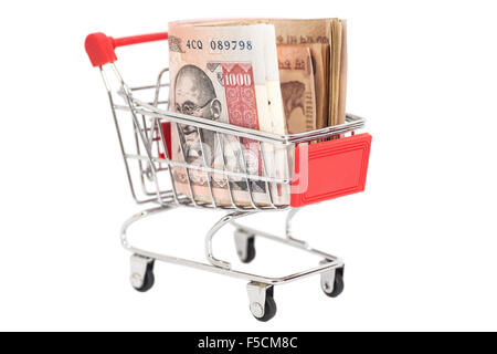 Indian 1000 rupees in shopping cart isolated on white background Stock Photo