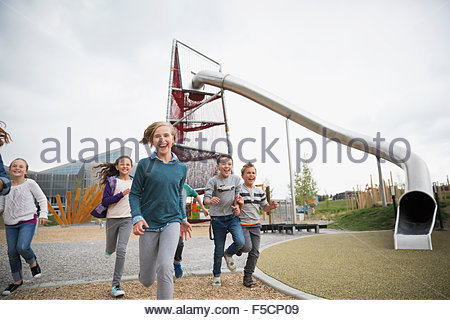 Enthusiastic kids running at playground