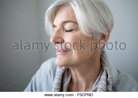 Portrait serene senior woman with eyes closed
