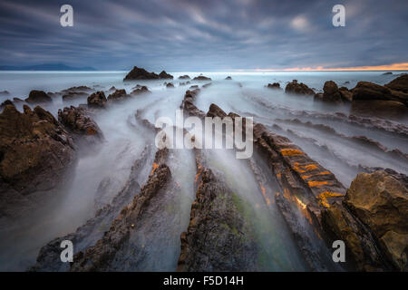 The wonderful Barrika Beach, in Vizcaya, Basque Country, Spain, on a cloudy evening. Stock Photo