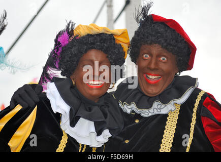 Leidschendam, Holland - November 13, 2010: Two Black Petes laughing in the camera during the arrival of Sinterklaas in Holland. Stock Photo