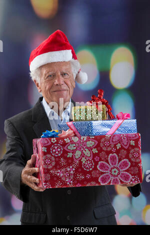 smiling man in suit and santa helper hat with gift Stock Photo - Alamy