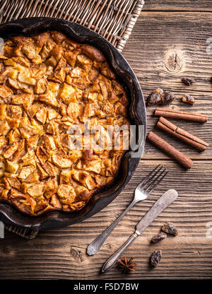 An apple pie and old cutlery (seen from above) Stock Photo