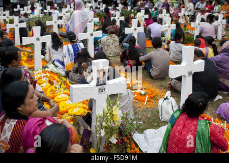 Nov. 2, 2015 - Dhaka, Dhaka, Bangladesh - November 02, 2015 Dhaka Bangladesh â€“ All Souls Day is a holy day set aside for honoring the dead. People light candles as they offer prayers for departed loved ones to mark All Souls' Day at the cemetery of Holy Rosary church in Dhaka, Bangladesh. Family throughout the day and night visited their familyâ€™s grave sites to honors the dead. (Credit Image: © K M Asad via ZUMA Wire) Stock Photo