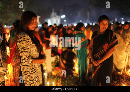 Nov. 2, 2015 - Dhaka, Dhaka, Bangladesh - November 02, 2015 Dhaka Bangladesh â€“ All Souls Day is a holy day set aside for honoring the dead. People light candles as they offer prayers for departed loved ones to mark All Souls' Day at the cemetery of Holy Rosary church in Dhaka, Bangladesh. Family throughout the day and night visited their familyâ€™s grave sites to honors the dead. (Credit Image: © K M Asad via ZUMA Wire) Stock Photo