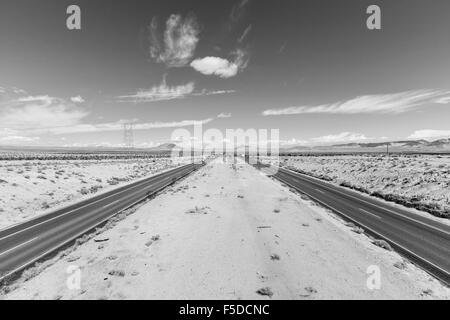 Interstate 15 between Los Angeles and Las Vegas in California's Mojave Desert black and white. Stock Photo