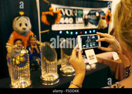 Napa, CA, USA. 29th Oct, 2015. Irene Stanley takes a photo of her kids, Elijah and Nina, with the Giants mascot Lou Seal and the Giants three World Series trophies at the Napa Valley Business Expo in the Chardonnay Hall at the Napa Valley Expo on Thursday. © Napa Valley Register/ZUMA Wire/Alamy Live News Stock Photo